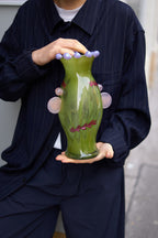 A unique blown-glass vase by Roksolana Hudoba, created through a process that begins with hand-drawn sketches and culminates in the transformation of molten glass into a refined decorative object. Classical forms are reinterpreted through subtle accents and contemporary proportions, resulting in a piece that feels both familiar and distinctly modern.