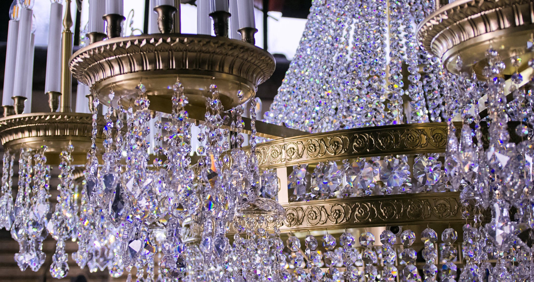 Close-up of engraved brass rings and octagon crystal garlands on a ZAVADSKI bespoke chandelier