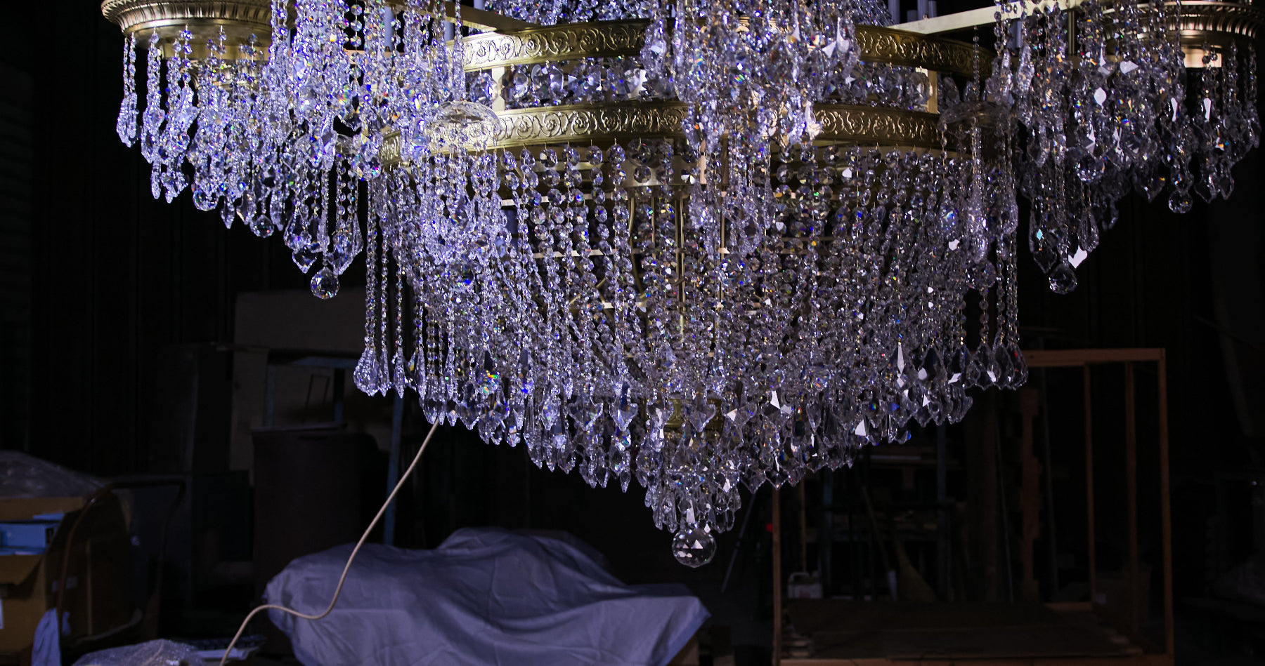 Underside of a large ZAVADSKI chandelier with cascading crystal garlands, pendants and a faceted crystal ball